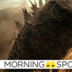 Godzilla turns his back on King Kong and walks away from the ruins of a destroyed cityl.